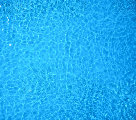 Clear blue swimming pool water.