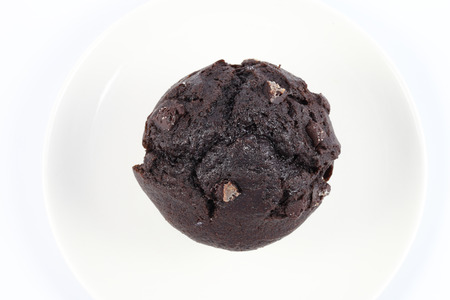 Chocolate brownies on a white plate and white backgroundの写真素材