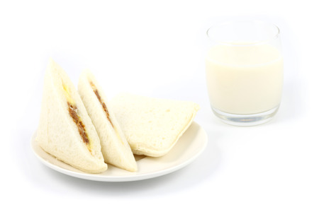 sandwich and a glass of milk on white backgroundの写真素材
