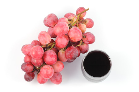 close up top side grape  fruit and glass of juice on white backgroundの写真素材