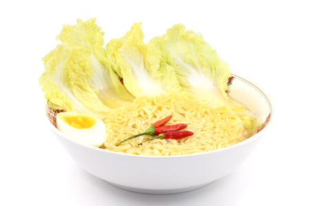 instant noodles in dish on white backgroundの写真素材