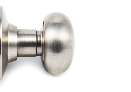 close up metal doorknob on white backgroundの写真素材