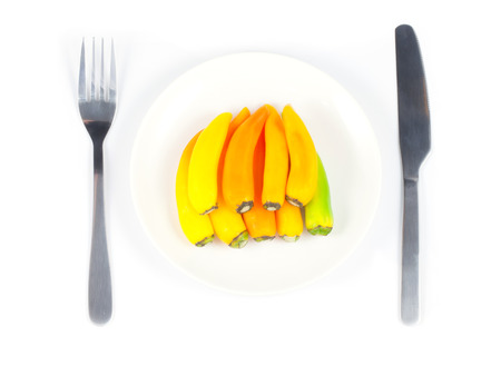 top side chili pepper on plate with white backgroundの写真素材