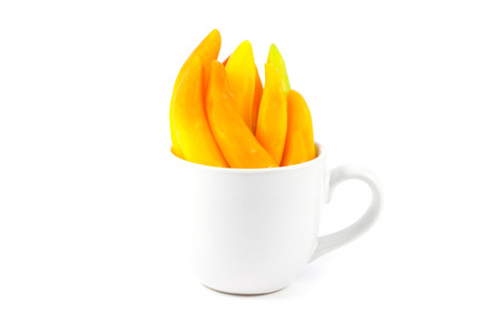 chili pepper in cup on white backgroundの写真素材