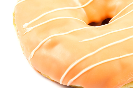 close up orange donut on white backgroundの写真素材