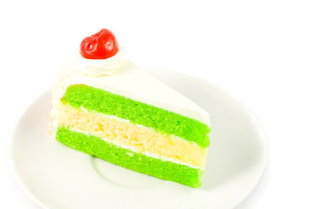 close up cake with cherry on white background