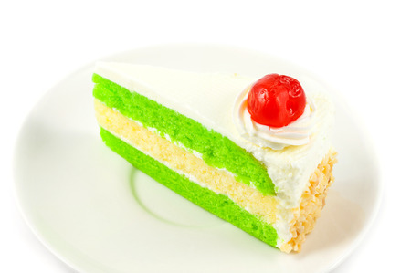 close up cake with cherry on white backgroundの写真素材