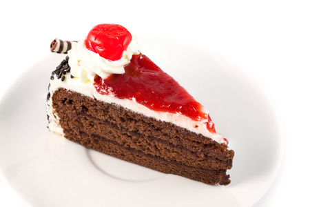 close up cake with cherry on white backgroundの写真素材