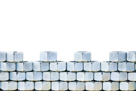 close up stack of metal nuts  on white backgroundの写真素材