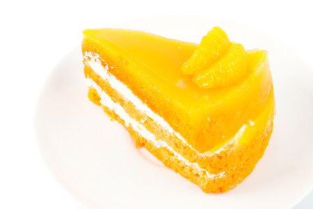 close up orange cake on white backgroundの写真素材