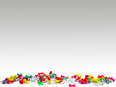 Colorful push pins on gray backgroundの写真素材