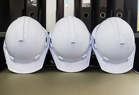 Plastic safety helmet on the cover flap