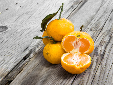 Orange fruit on wood backgroundの写真素材