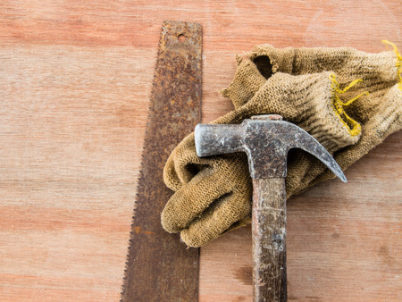 Dirty set of hand tools on grunge wood