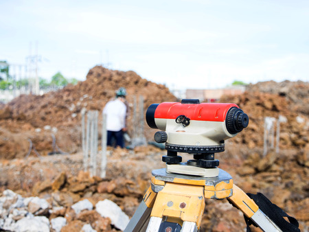 Surveyor equipment tacheometer or theodolite outdoors at construction site