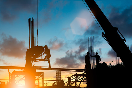 Silhouette construction industry team safely to work load concrete building according to set goal...