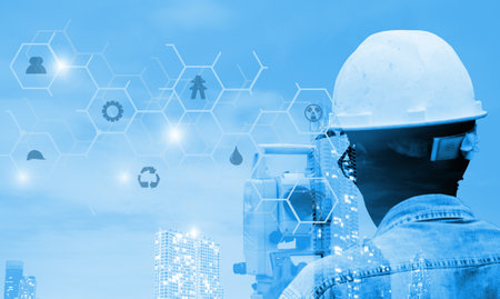 Engineer working on building construction site with blue sky background, engineering and...