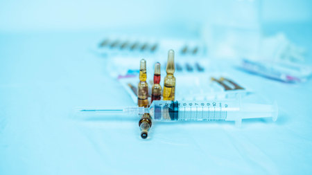 Medical syringes and ampoules on a white background.の写真素材