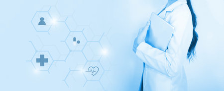 woman young  doctor hand holding blur tablet shows a list of patients and icon medical network connection on virtual screen interface.Vaccination concept. laboratory, medical and healthcareの写真素材