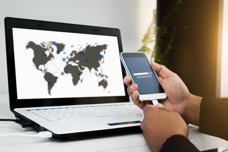 businessman using smartphone upload data to online store Documentation over blurred Distributed threat information to clients for customer network connection .digital  technology.select focusの写真素材