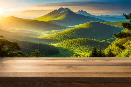 Wooden table top on green valley with mountain view at sunset.の素材