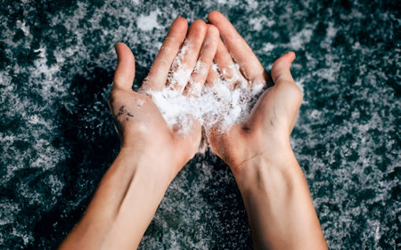 Woman's hands with soap foam on the background of the sea.の素材