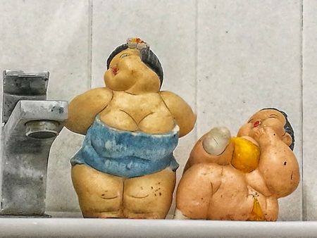 two sexy clay dolls on laughingの写真素材