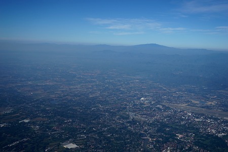 Aerial photos Shows lots of clouds like the sea. And the atmosphere of the airport. Including downtown Chiang Mai.の写真素材