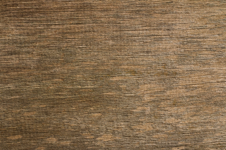 Dark brown scratched wooden cutting board. Wood textureの写真素材