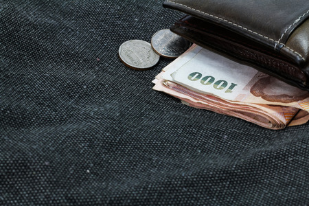 wallet with money on bagsの写真素材