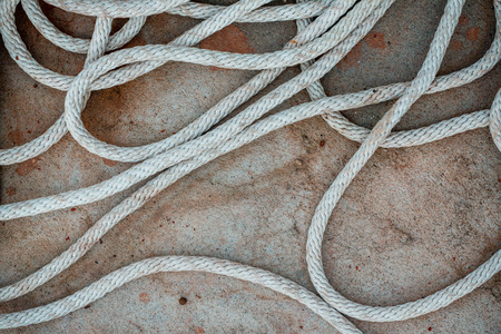 eight rope knot on rocky backgroundの写真素材