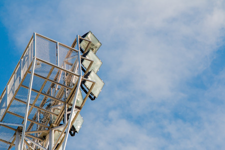 Pillar spotlights high on the blue skyの写真素材