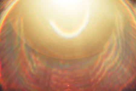 Lens flare light over black background.
