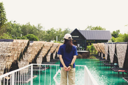 Asian Thai woman visiting cafe nature walk.の写真素材