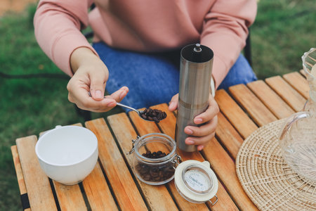 Drip coffee on vacation outdoor and drinking a cup of hand coffee in autumn morning. relax and enjoy outdoor lifestyle and holiday travel vacation.の写真素材