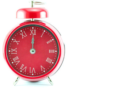 on the left hand red style alarm clock on white background