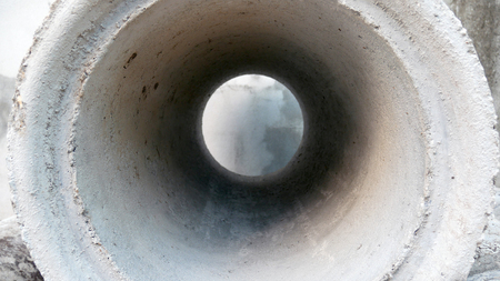 Inside the cement pond. Hole of cement pond.の写真素材