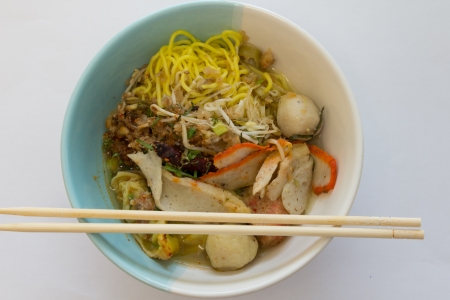 Thai noodle tom-yum-pork with fish balls  の写真素材