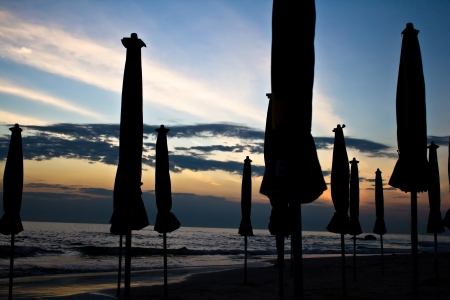 sunrise with Umbrella on the beach , Hua hin Thailand の写真素材