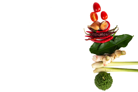 Ingredients (Tom-yum) include lemongrass, kaffir lime, tomato,chilli pepper,galangal on white background.の写真素材