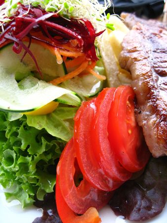 Tasty steak with vegetablesの写真素材
