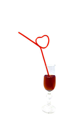 hearts shapes straws in wine classの写真素材