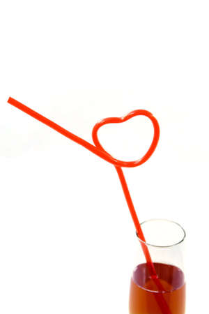 hearts shapes straws in wine classの写真素材
