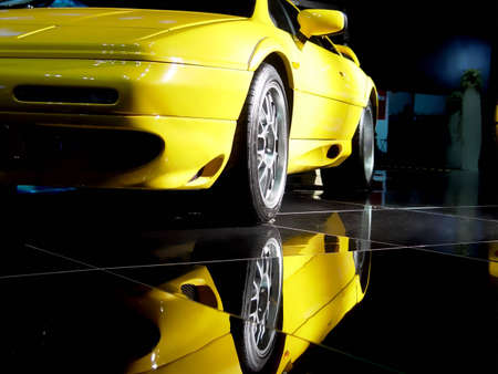 Car and its reflection in dark                               の写真素材