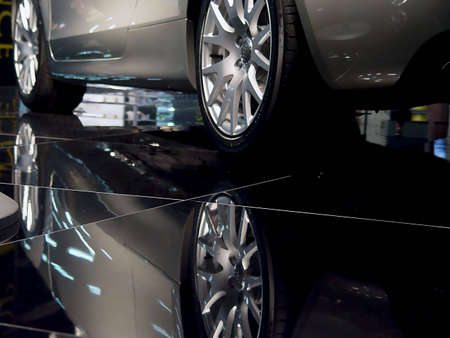 Car and its reflection in dark                               