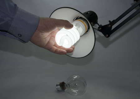 Use an energy efficient bulb to replace the old incandescentの写真素材