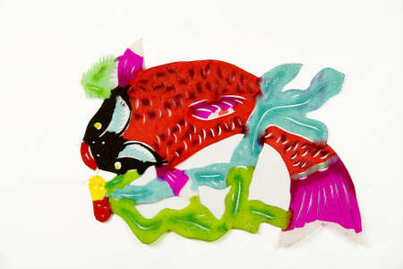 The traditional paper cut fish on the whiteの写真素材