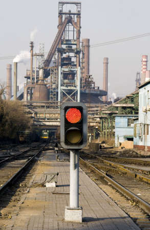 Railway signal gantry showing a red lightの写真素材