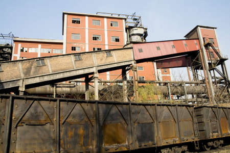 Old rusty train wagon on the factoryの写真素材