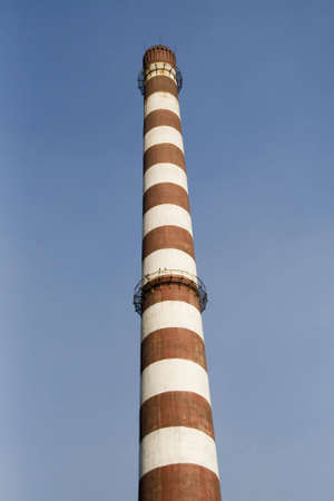 Chimney of a factory and blue sky